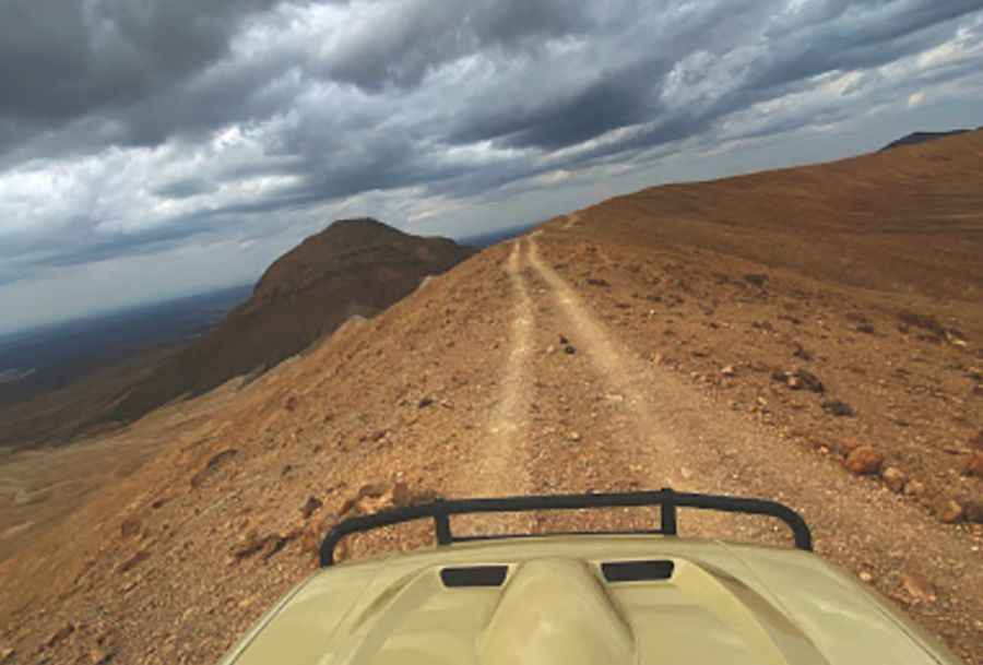 A cliff road on the edge of the Black and White volcano