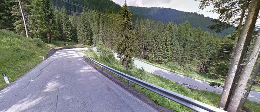 A curvy paved road to San Pellegrino Pass in the Alps