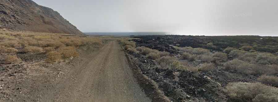 A gravel road to the virgin Verodal beach in Canary Islands