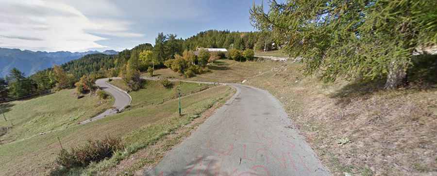 A steep paved road to Col Tze Core in the Aosta Valley