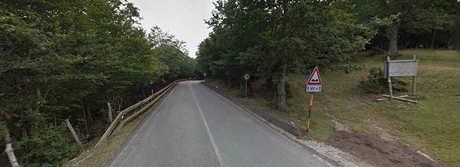 A winding paved road to Portella Femmina Morta