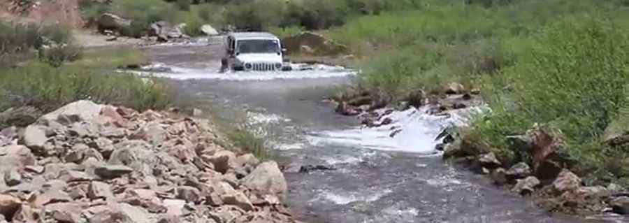 Crossing rivers on the scenic Halfmoon Road in Colorado