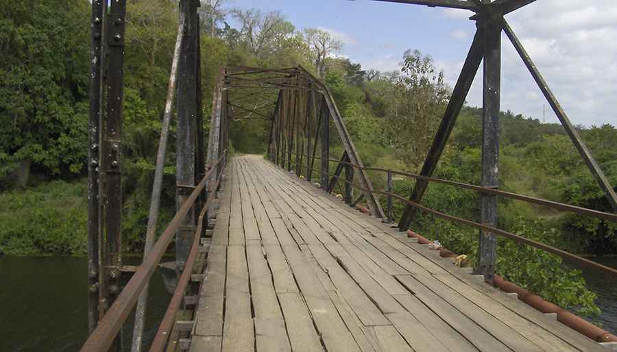 Crossing the wild Sigi river bridge