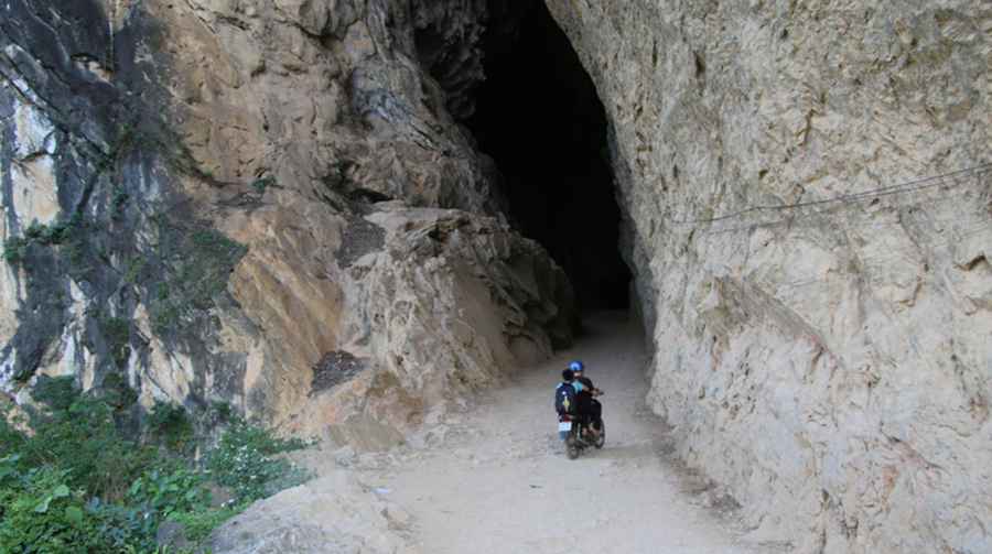 Driving a challenging road through Hang Ban Tham Cave