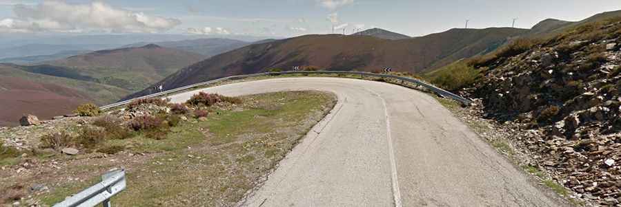 Driving the cracked road to Alto del Morredero in Castile and Leon