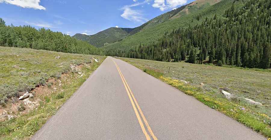 Driving the scenic Castle Creek Road in Colorado with beautiful aspen trees