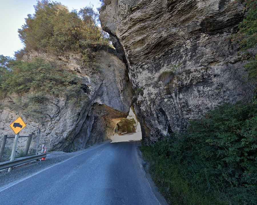 Driving through the Pohara Natural Bridge in the South Island