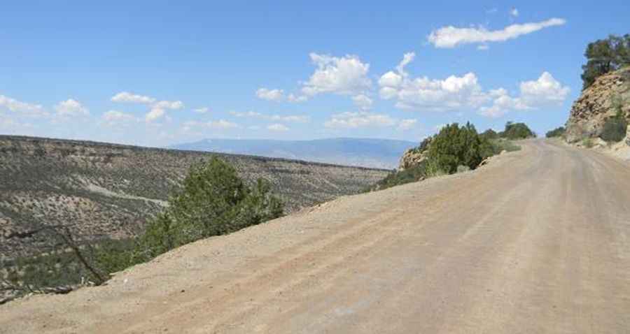 Is the Nucla-Delta Road to Columbine Pass in Colorado unpaved?