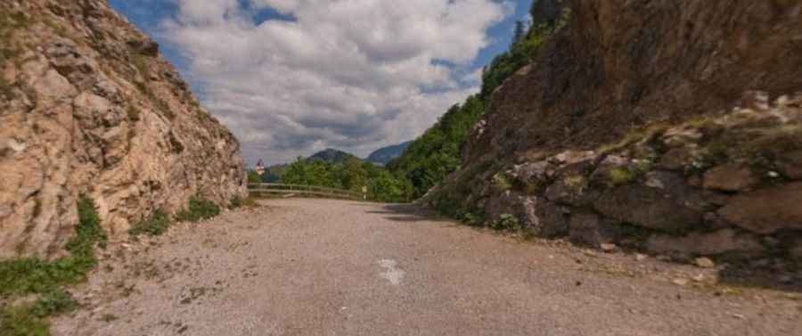 Is the old road through Loibl Pass unpaved?