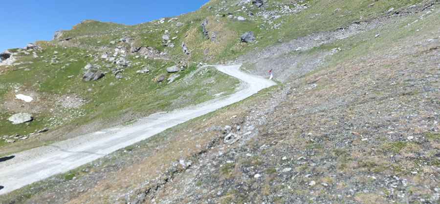 Is the road to Col des Vaux unpaved?