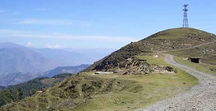 Is the road to Natha Top unpaved?