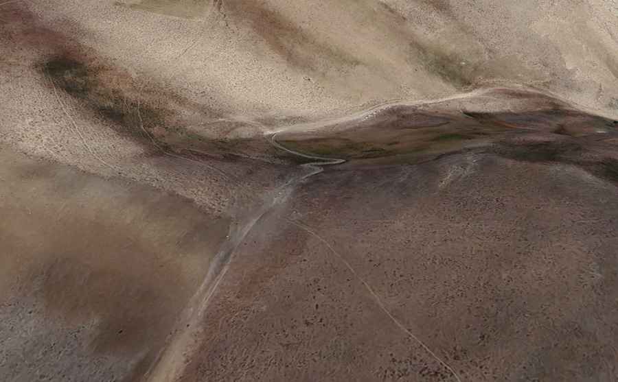 Is the road to Qarah Kōtal unpaved?