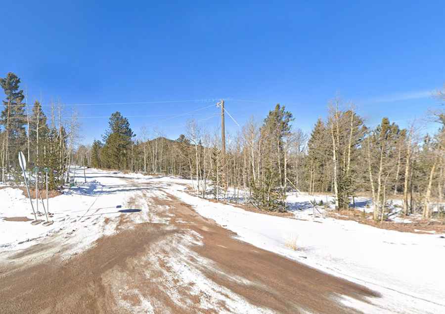 Is the road to Rhyolite Mountain unpaved?