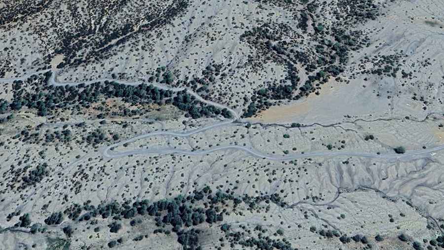 Is the road to Tizi Bou Taouelt unpaved?