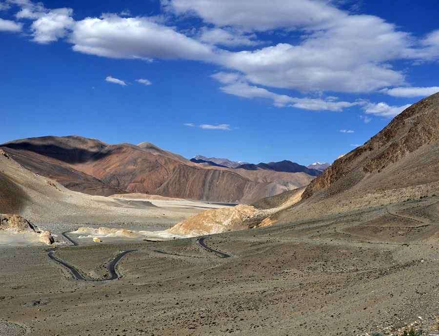 The paved road to Surtok La with stunning views of Pangong Lake