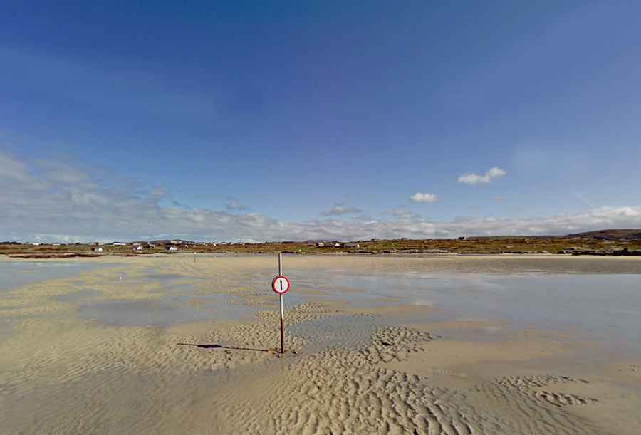 The road to Omey Island off the coast of Connemara gets swallowed by the sea