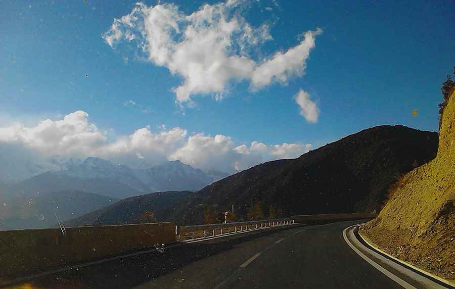 Where is the Baima Snow Mountain Pass?